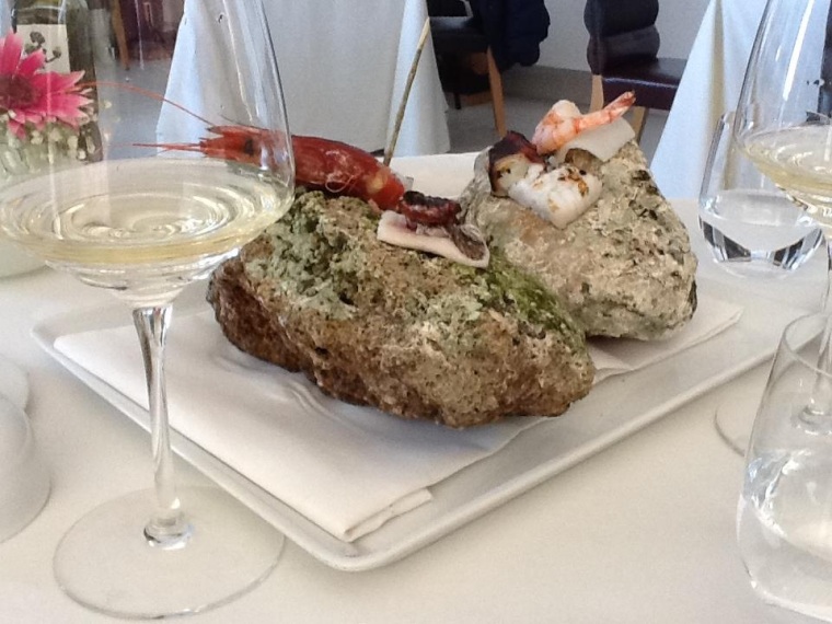 Local caught treasures of the sea naturally steamed on a base of hot stones well paired with Scala Fenicia wine of Capri    