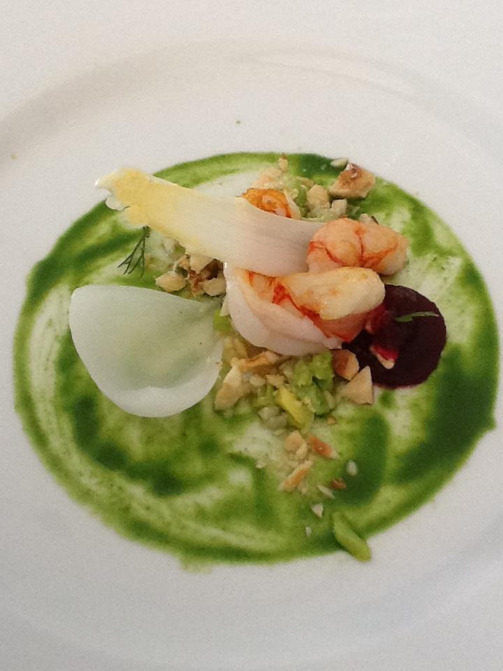 The pistachio and herb aromatic bed for the prawns, crusted nuts and beet sauce on the side